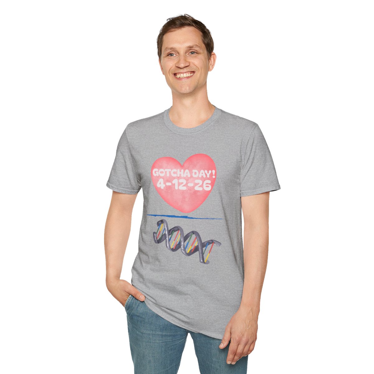 Person wearing a gray T-shirt with a heart graphic reading ‘Gotcha Day 4‑12‑26’ above a colorful DNA illustration.