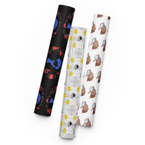 Set of three rolled fabric sheets with playful cartoon-style patterns in black, white, and brown.