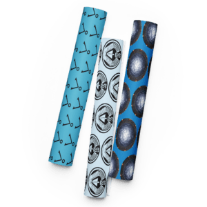 Set of rolled fabric wraps with blue and white patterns, including anchors and galaxy-style designs.